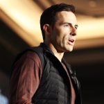 Calvin McDonald in vest on stage