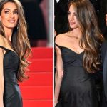 Amal Clooney at the "Bono: Stories of Surrender" Premiere at The 78th Cannes Film Festival at Palais des Festivals on May 16, 2025 in Cannes, France, Amal Clooney Continues Her Archival Streak in Sweetheart Galliano for Dior Gown With Bono at Cannes Film Festival 2025