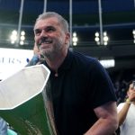 Tottenham Hotspur manager Ange Postecoglou with the UEFA Europa League trophy on the pitch after the Premier League match at the Tottenham Hotspur Stadium, London. Picture date: Sunday May 25, 2025.