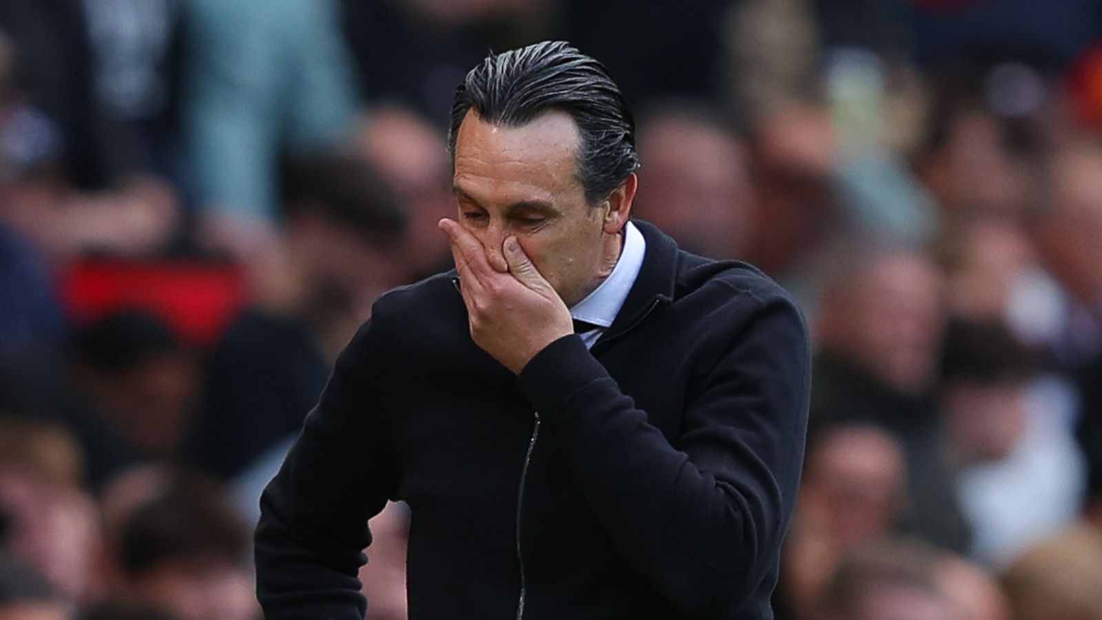 Aston Villa boss Unai Emery watches on from the sidelines at Old Trafford during the 2-0 loss