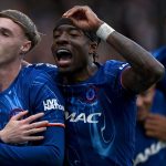 Cole Palmer celebrates scoring Chelsea's third goal against Liverpool