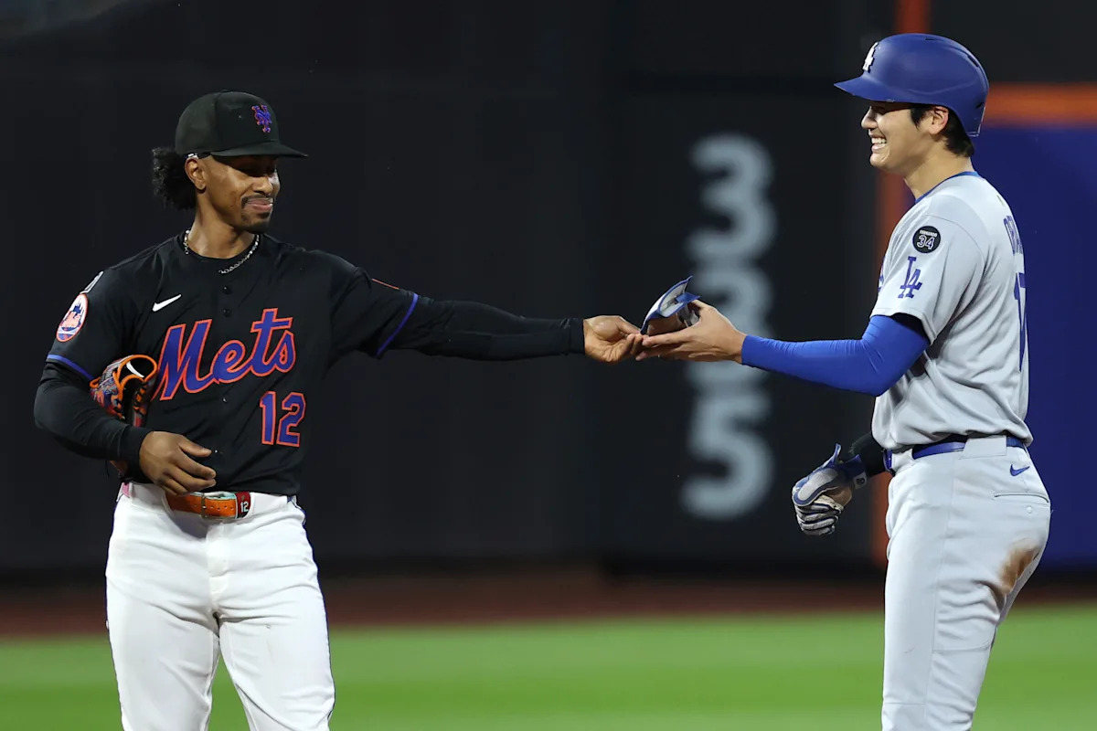 Dodgers begin grueling stretch with soggy marathon win over Mets despite undermanned pitching staff