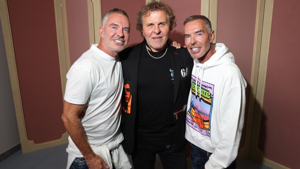 MILAN, ITALY - SEPTEMBER 22: Renzo Rosso (C), Dean and Dan Caten are seen backstage at the Dsquared2 S/S 2023 fashion show during the Milan Fashion Week Womenswear Spring/Summer 2023 on September 22, 2022 in Milan, Italy. (Photo by Victor Boyko/Getty Images for Dsquared2)