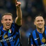 Inter Milan's Davide Frattesi, left, celebrates after scoring his side's fourth goal during the Champions League semifinal second leg soccer match between Inter Milan and Barcelona at San Siro stadium in Milan , Italy, Tuesday, May 6, 2025. (AP Photo/Luca Bruno)