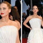 Jennifer Lawrence wears dior fan dress, Robert Pattinson at the "Die, My Love" Premiere during the 78th Cannes Film Festival held at Palais des Festivals on May 17, 2025 in Cannes, France.