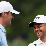 Scottie Scheffler and Xander Schauffele smile on the fifth hole during a practice round for the PGA Championship golf tournament at the Quail Hollow Club, Tuesday, May 13, 2025, in Charlotte, N.C. (AP Photo/George Walker IV)