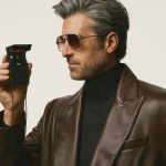 Patrick Dempsey wearing the Tag Heuer Jack Heuer sunglass design, mirroring a famous picture of the watchmaker's honorary chairman holding a chronograph.