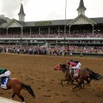 Brian Hernandez Jr. rides Mystik Dan, left, to the finish line to win the 150th running of the Kentucky Derby
