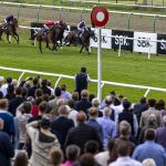 Rogue Millennium (red, on outisde) gets up late to win at Lingfield