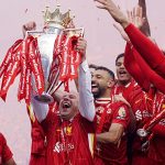 Liverpool manager Arne Slot lifts the Premier League trophy