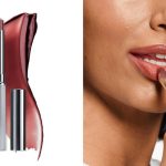 Clinique Nude Honey Almost lipstick with swatch; woman testing Clinique's Nude Honey Almost lipstick