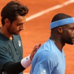 Winner Italy's Lorenzo Musetti, left, and Frances Tiafoe of the U.S. walk after their quarterfinal match of the French Tennis Open at the Roland-Garros stadium in Paris, Tuesday, June 3, 2025. (AP Photo/Aurelien Morissard)