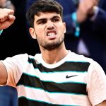 Spain's Carlos Alcaraz reacts after winning a game during his men's singles final match against Italy's Jannik Sinner on day 15 of the Frenc