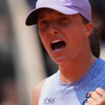Poland's Iga Swiatek celebrates as she won the quarterfinal match of the French Tennis Open against Ukraine's Elina Svitolina