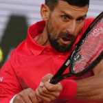 Serbia's Novak Djokovic plays a shot against Germany's Alexander Zverev during their quarterfinal match of the French Tennis Open at the Roland-Garros stadium in Paris, Wednesday, June 4, 2025. (AP Photo/Aurelien Morissard)