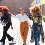 multiethnic happy friends young women laugh together. Female people smile and joy of friendship. urban youth gen z concept.