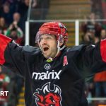 Joey Martin arms outstretched after scoring a goal
