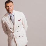 Brunello Cucinelli pants, blazer, shirt, tie, pocket square and shoes.