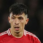 Lisandro Martinez runs with the ball during the English Premier League soccer match between Fulham and Manchester United