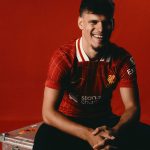 Milos Kerkez poses for a photograph after signing a contract with Liverpool