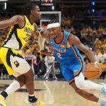 Oklahoma City Thunder guard Shai Gilgeous-Alexander drives as Aaron Nesmith. (AP Photo/Michael Conroy)