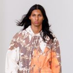 A model wears a look from Etudes Studio's Spring 2026 collection on the runway at Paris Fashion Week.