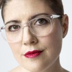 Christine Hunsicker wearing glasses and white top.