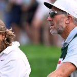 Tommy Fleetwood, from England, reacts as Keegan Bradley prepares to putt for the win during the final round of the Travelers Championship golf tournament at TPC River Highlands, Sunday, June 22, 2025, in Cromwell, Conn. At right is Fleetwood's caddie Ian Finnis. (AP Photo/Jessica Hill)
