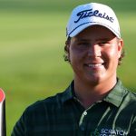 Aldrich Potgieter, of South Africa, poses with the trophy after winning a play-off at the PGA Tour's Rocket Classic