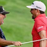 Keegan Bradley, right, celebrates with caddie Scott Vail, left, after winning of the Travelers Championship golf tournament at TPC River Highlands, Sunday, June 22, 2025, in Cromwell, Conn. (AP Photo/Jessica Hill)