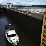 The Ella Victoria of Rexford heads through Lock 7 of the Erie Canal on the Mohawk River in Niskayuna, N.Y.