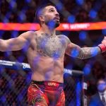 Ilia Topuria celebrates after defeating Charles Oliveira in a lightweight title fight at UFC 317, Saturday, June 28, 2025, in Las Vegas. (AP