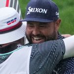 J.J. Spaun celebrates by hugging his caddie, Mark Carens, after making a birdie putt on the 18th hole during the final round of the U.S. Open golf tournament at Oakmont Country Club Sunday, June 15, 2025, in Oakmont, Pa. (AP Photo/Gene J. Puskar)