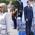 France's President Emmanuel Macron speaks with his wife Brigitte Macron as they leave the annual Bastille Day military parade on the Champs-Elysees Avenue in Paris on July 14, 2025. (Photo by Mohammed  BADRA / POOL / AFP) (Photo by MOHAMMED  BADRA/POOL/AFP via Getty Images)