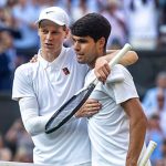Winner Jannik Sinner of Italy and Carlos Alcaraz of Spain embrace at the net after the Gentlemen's Singles Final on Centre Court during the