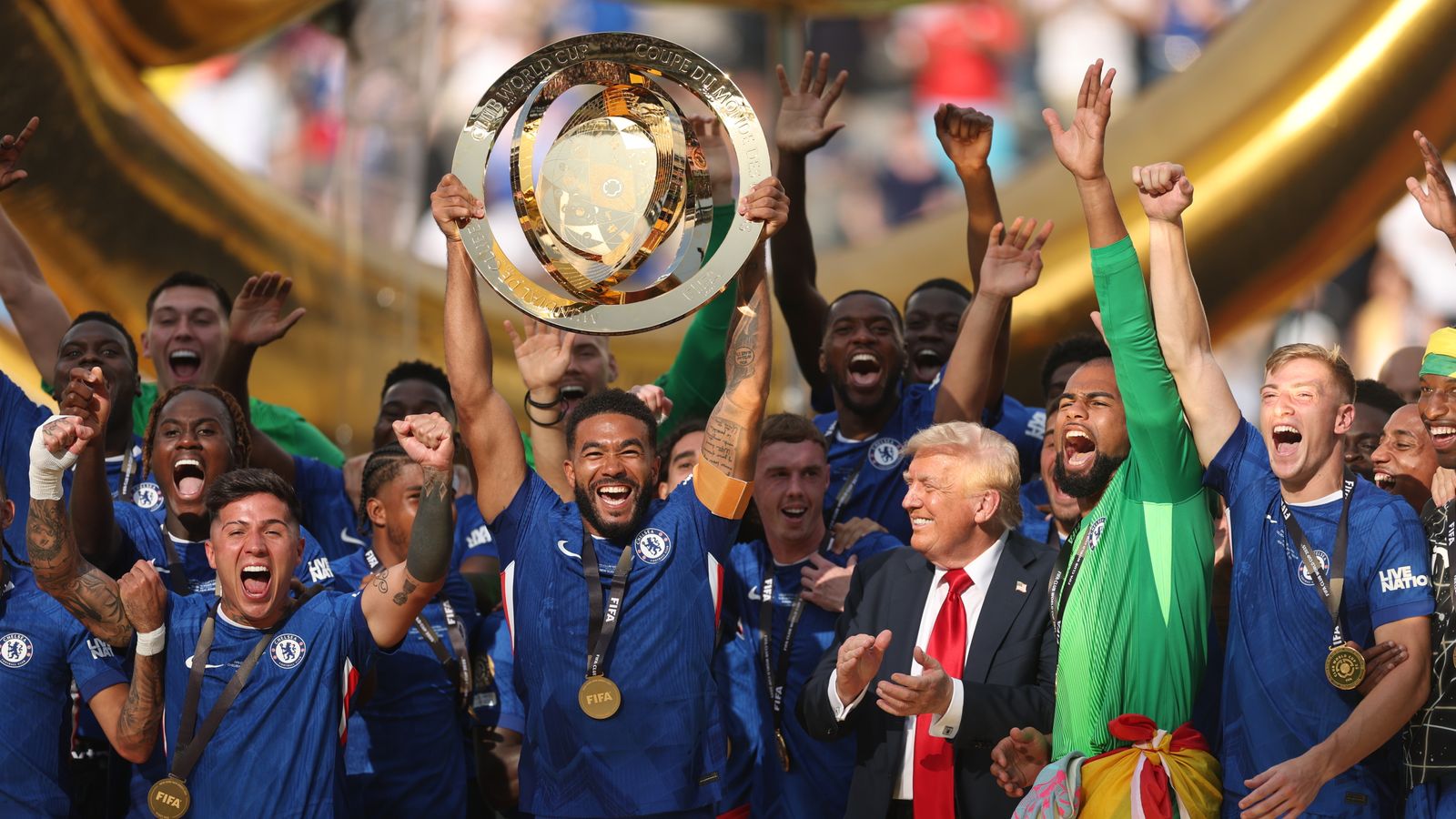 USA President Donald Trump looks on as Chelsea captain Reece James lifts the Club World Cup