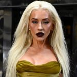 Christina Aguilera dons dark glam for the "Burlesque: The Musical" photocall in London.