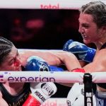 England's Ellie Scotney, left, punches Mexico's Yamileth Mercado during the eighth round of a super bantamweight boxing match Friday, July 11, 2025, in New York. (AP Photo/Frank Franklin II)