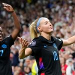 Michelle Agyemang and Chloe Kelly celebrate the latter's late extra-time goal to send England into the Euro 2025 final