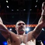 Oleksandr Usyk celebrates after knocking down Daniel Dubois in the fifth round at Wembley