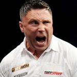 Gerwyn Price celebrates in his match against Luke Littler during the BetMGM Premier League Play-Offs at The O2, London