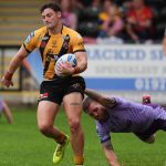Castleford Tigers' Joshua Simm misses a tackle from Warrington Wolves' Marc Sneyd in the Betfred Super League