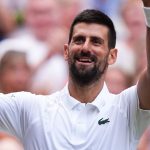 Novak Djokovic celebrates his 100th win at Wimbledon