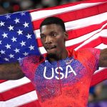Fred Kerley, of the United States, celebrates after his third place finish in the men's 100-meter final at the 2024 Summer Olympics, Sunday, Aug. 4, 2024, in Saint-Denis, France. (AP Photo/Bernat Armangue)