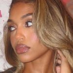 Lori Harvey’s Sleek Updo Is The Unexpected Star Of Her Vacation Style