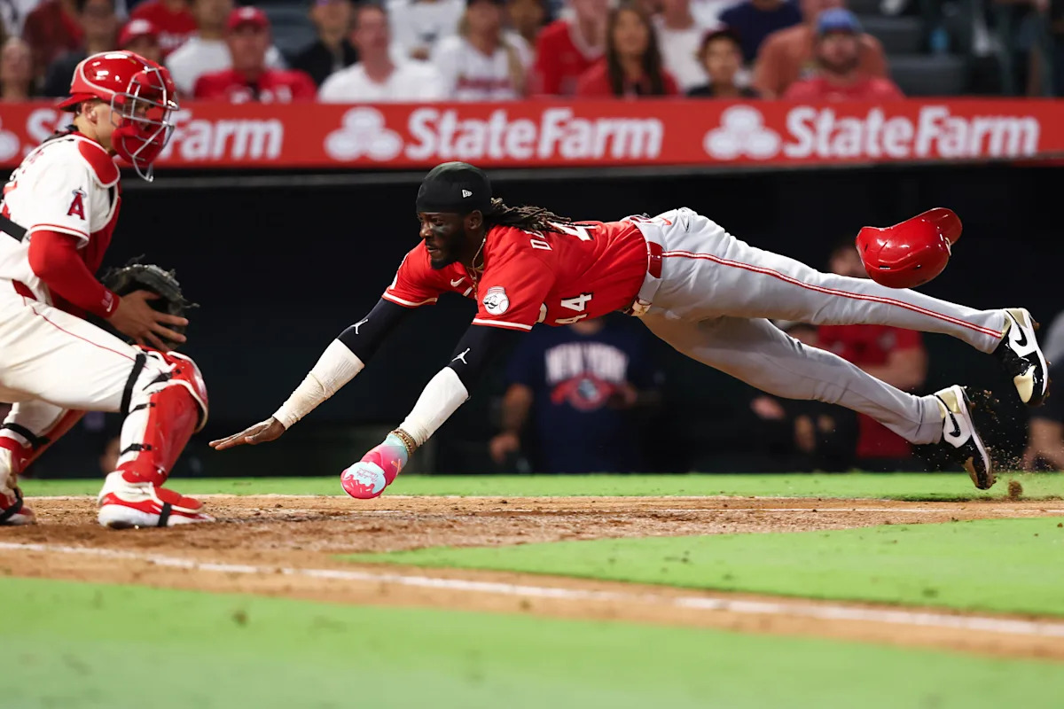 Lux hits 2-run homer and Singer pitches triple-happy Reds to 4-1 win over Angels