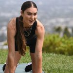 Celebrity trainer Kirsty Godso guides attendees on a workout during a media preview of her Airbnb Originals Experience at an Airbnb home ahead of the AirBNB Summer Release in Beverly Hills, California on May 12, 2025. Airbnb began letting users book in-home massages, chefs and personal trainers in an overhauled app as it continued to expand beyond being just a platform for short-term lodging. "Hotels do have one thing that we don't have and those are services," said chief executive Brian Chesky at a launch event in Los Angeles. (Photo by Patrick T. Fallon / AFP) (Photo by PATRICK T. FALLON/AFP via Getty Images)