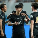 Son Heung-Min of Tottenham is embraced by teammates Brennan Johnson and Archie Gray as he is substituted off having played his final game