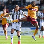 PAISLEY, SCOTLAND - AUGUST 09: St Mirren's Marcus Fraser and Motherwell's Tawanda Maswanhise in action during a William Hill Premiership match between St Mirren and Motherwell at the SMiSA Stadium, on August 09, 2025, in Paisley, Scotland. (Photo by Craig Williamson / SNS Group)