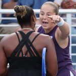 Jelena Ostapenko of Latvia (R) argues with Taylor Townsend of the United States (L) following their Women's Singles Second Round match on Da